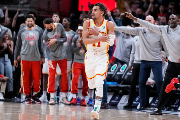 Mar 3, 2022; Atlanta, Georgia, USA; Atlanta Hawks guard Trae Young (11) reacts after making a three point shot against the Chicago Bulls during the second half at State Farm Arena.